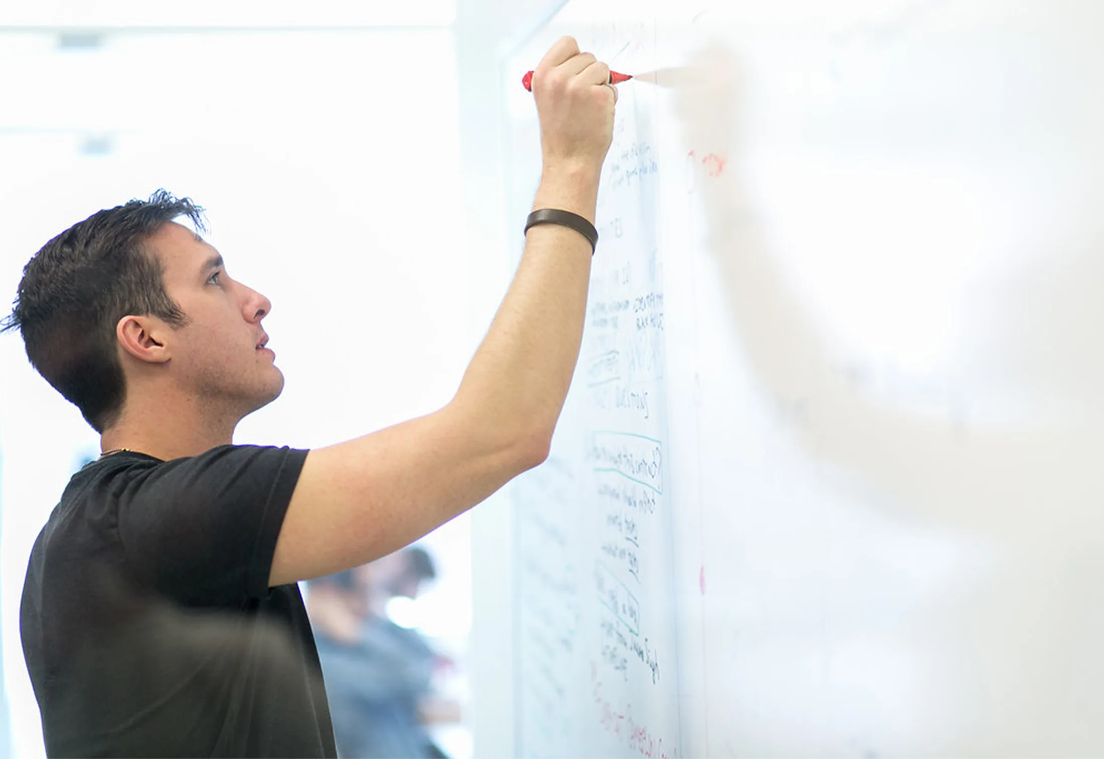 Justin Kirkey collaborating with his team